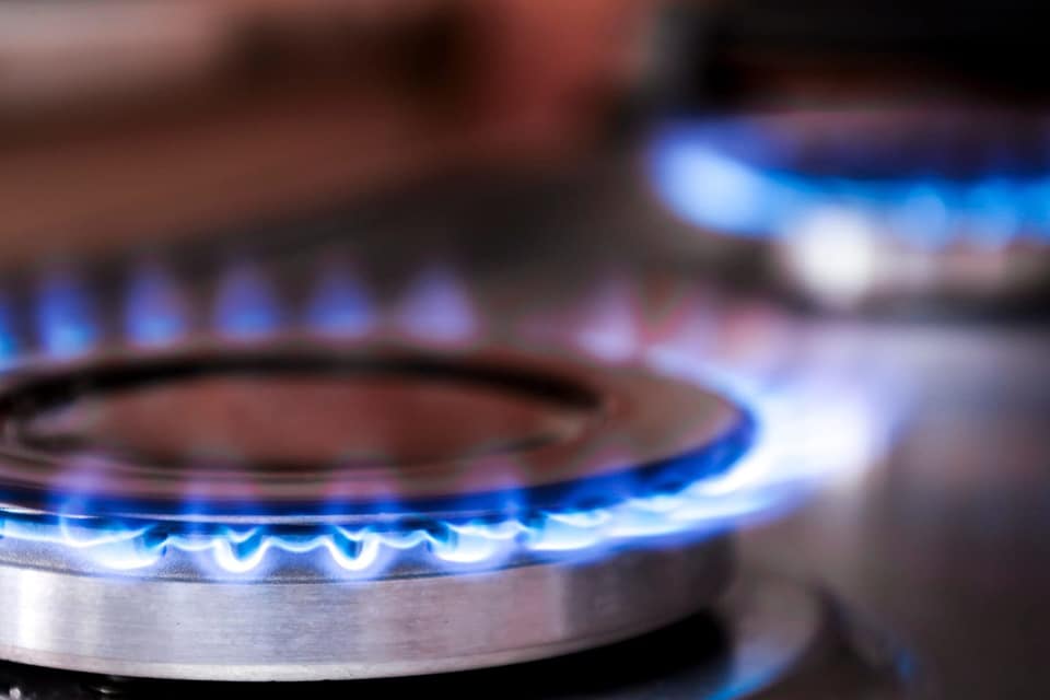 Blue flame gas hob rings with flames lit