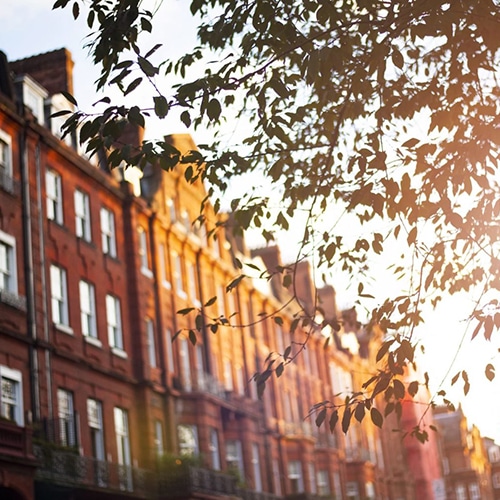 Traditional red brick apartment block at dusk