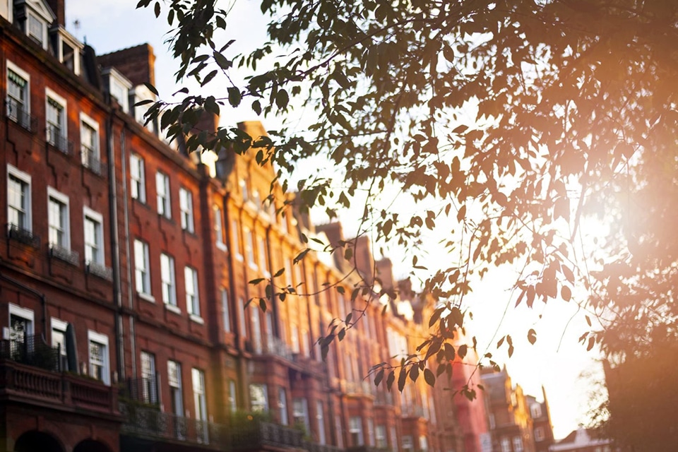 Traditional red brick apartment block at dusk